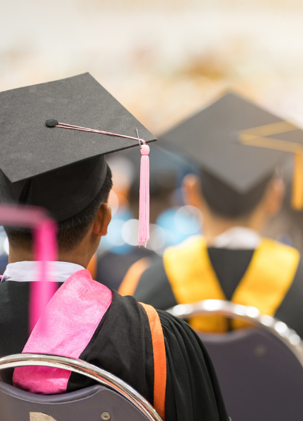 People graduating from university with gaps and gowns