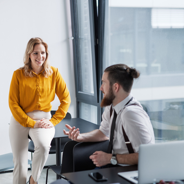 Man talking to a women in the office