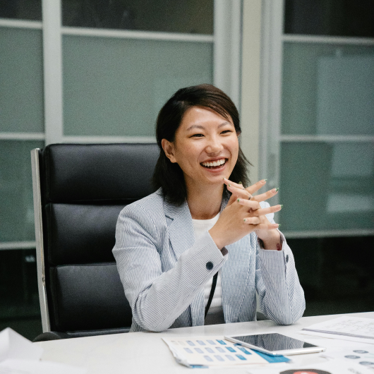 Image of happy woman at desk