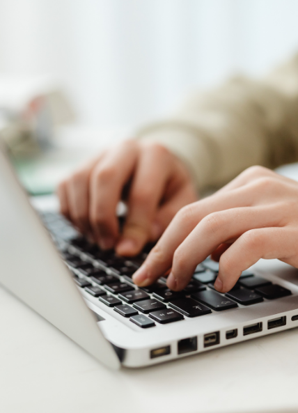 Person typing on laptop