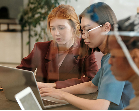 Duo looking at laptop