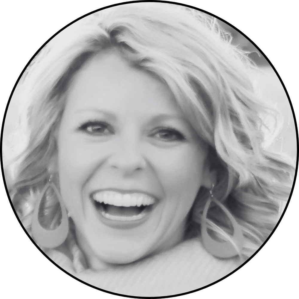 Headshot of Jamie Liechty, smiling, in black and white