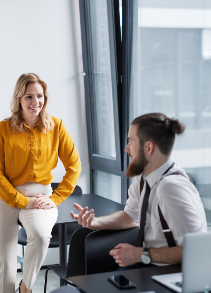 Man talking to a women in the office